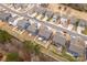 Aerial view of homes in a neighborhood showcasing privacy fences, landscaping, backyards, and street access at 393 Brannon Meadows Dr, York, SC 29745