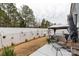 Large backyard with seating area, hot tub with gazebo, well-maintained lawn, and white fence at 393 Brannon Meadows Dr, York, SC 29745