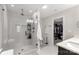 Modern bathroom featuring a glass enclosed shower with shelving and a walk-in closet at 393 Brannon Meadows Dr, York, SC 29745