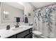 Stylish bathroom with a modern vanity, a large mirror, and a floral shower curtain at 393 Brannon Meadows Dr, York, SC 29745