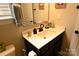 Bathroom features a dark vanity, matte black faucet and hardware, and sleek white countertop at 393 Brannon Meadows Dr, York, SC 29745