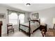 Cozy bedroom featuring a four-poster bed, natural light, and soft décor at 393 Brannon Meadows Dr, York, SC 29745