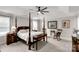 Comfortable bedroom with a four-poster bed, ceiling fan, and calming neutral décor at 393 Brannon Meadows Dr, York, SC 29745
