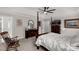 Bright bedroom featuring a four-poster bed, ceiling fan, and antique furniture at 393 Brannon Meadows Dr, York, SC 29745