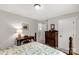 Well-lit bedroom boasts a four-poster bed, desk, dresser, and neutral walls at 393 Brannon Meadows Dr, York, SC 29745