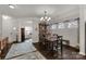 Open concept dining area featuring hardwood floors, crown molding, and a stylish chandelier at 393 Brannon Meadows Dr, York, SC 29745