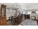 Modern dining area seamlessly connected to the kitchen with hardwood floors and a stylish chandelier at 393 Brannon Meadows Dr, York, SC 29745