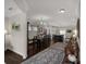 Open concept dining room with hardwood floors, elegant chandelier, and seamless transition into the kitchen at 393 Brannon Meadows Dr, York, SC 29745