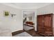 Inviting foyer featuring hardwood floors, decorative rugs, and a view into the main living spaces at 393 Brannon Meadows Dr, York, SC 29745