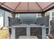 Hot tub under gazebo with curtains, stone base, and nearby access to the home at 393 Brannon Meadows Dr, York, SC 29745
