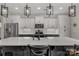 Bright kitchen boasts pendant lighting, white cabinets, and a stainless steel refrigerator at 393 Brannon Meadows Dr, York, SC 29745