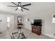 Relaxing living room featuring a ceiling fan, television, and glass coffee table at 393 Brannon Meadows Dr, York, SC 29745