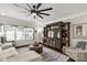 Comfortable living room features a ceiling fan, large windows, and a decorative rug at 393 Brannon Meadows Dr, York, SC 29745