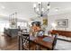 Open concept living space featuring hardwood floors, a modern kitchen island, and a view into the living room at 393 Brannon Meadows Dr, York, SC 29745