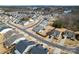 Serene aerial view of a residential community, showcasing tree-lined streets and well-maintained homes at 4000 Spring Cove Way, Belmont, NC 28012