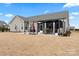 Backyard featuring a covered patio and outdoor dining area, ideal for entertaining guests at 4000 Spring Cove Way, Belmont, NC 28012