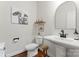 Elegant powder room with pedestal sink, decorative mirror and stylish accents at 4000 Spring Cove Way, Belmont, NC 28012