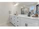 Modern bathroom features a double vanity, large mirror, and a glass enclosed shower with a black frame at 4000 Spring Cove Way, Belmont, NC 28012