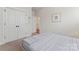 Neutral bedroom with a comfortable bed, closet, and picture on the wall at 4000 Spring Cove Way, Belmont, NC 28012