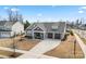 Well-maintained home with a three-car garage, neat landscaping, and an inviting front porch at 4000 Spring Cove Way, Belmont, NC 28012