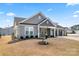 Charming home exterior with a manicured lawn and a three-car garage at 4000 Spring Cove Way, Belmont, NC 28012