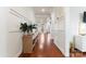 Elegant foyer showcasing hardwood floors, white paneled walls, and sophisticated decorative accents at 4000 Spring Cove Way, Belmont, NC 28012