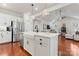Bright, open kitchen featuring a farmhouse sink, stainless steel appliances, and a large island at 4000 Spring Cove Way, Belmont, NC 28012