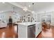 Bright kitchen with modern fixtures, stainless steel dishwasher, and an open view to the living and dining areas at 4000 Spring Cove Way, Belmont, NC 28012