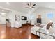 Inviting living room featuring hardwood floors, vaulted ceiling, and comfortable seating at 4000 Spring Cove Way, Belmont, NC 28012