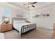 Serene primary bedroom with tray ceiling, plush carpeting, and plenty of natural light at 4000 Spring Cove Way, Belmont, NC 28012