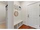 Hallway mudroom area features a convenient bench, storage and coat hooks at 4000 Spring Cove Way, Belmont, NC 28012