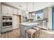 Modern kitchen with white countertops, pendant lighting, stainless steel appliances, and a center island with seating at 4004 Caymen Bay Ct, Tega Cay, SC 29708