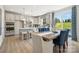 Open-concept kitchen and dining area with modern cabinets, a center island, and stainless steel appliances at 4004 Caymen Bay Ct, Tega Cay, SC 29708