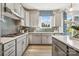Well-lit kitchen with white countertops, stainless steel appliances, and stylish backsplash tiles at 4004 Caymen Bay Ct, Tega Cay, SC 29708