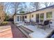 Back patio with outdoor furniture and a brick walkway at 435 Caldwell Se Dr, Concord, NC 28025