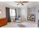 Cozy Bedroom with a soft chair, neutral colors, and ample lighting at 435 Caldwell Se Dr, Concord, NC 28025