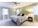 Spacious primary bedroom with two windows, natural light, and ceiling fan at 435 Caldwell Se Dr, Concord, NC 28025