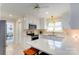 Bright kitchen with white cabinets, stainless steel appliances, and quartz countertops at 435 Caldwell Se Dr, Concord, NC 28025