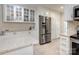 Spacious kitchen with custom white cabinets, stainless steel appliances, and generous countertop space at 435 Caldwell Se Dr, Concord, NC 28025