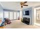 Spacious living room featuring a fireplace and large windows with outdoor views at 435 Caldwell Se Dr, Concord, NC 28025