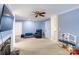 Comfortable living room with fireplace, blue walls and multiple access points to other rooms at 435 Caldwell Se Dr, Concord, NC 28025