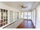Bright sunroom with red brick floors, white trim and many glass doors at 435 Caldwell Se Dr, Concord, NC 28025
