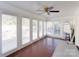 Bright sunroom with red brick floors, white trim and many large windows at 435 Caldwell Se Dr, Concord, NC 28025