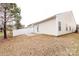 A cozy backyard featuring a small patio and a white picket fence at 5216 Crystal Lakes Dr, Rock Hill, SC 29732