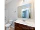 Bathroom featuring a dark wood vanity, a shower-tub combo, and a large mirror, offering functionality and style at 5216 Crystal Lakes Dr, Rock Hill, SC 29732