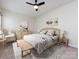 Bright bedroom with ceiling fan, natural wood furniture, and modern decor for a relaxing atmosphere at 5216 Crystal Lakes Dr, Rock Hill, SC 29732