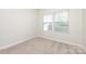 Neutral bedroom with new carpet, double windows, and fresh paint offers a serene and comfortable space at 5216 Crystal Lakes Dr, Rock Hill, SC 29732