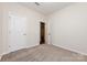 Neutral bedroom with new carpet and a closet, and an open doorway, creating a comfortable and inviting space at 5216 Crystal Lakes Dr, Rock Hill, SC 29732