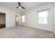 Bright, airy bedroom with neutral carpet, ceiling fan, and dual windows providing ample natural light at 5216 Crystal Lakes Dr, Rock Hill, SC 29732