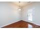 Cozy dining space with hardwood floors, neutral walls, and a glass-paneled door offering exterior views and ample light at 5216 Crystal Lakes Dr, Rock Hill, SC 29732